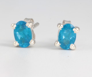 A pair of neon apatite silver ear studs approx 1.2ct 