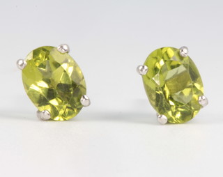 A pair of peridot and silver ear studs approx. 1.2ct 