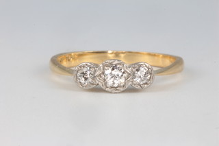 An 18ct yellow gold 3 stone diamond ring 2.5 grams, size M 1/2