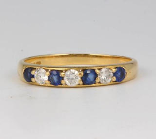 An 18ct yellow gold diamond and sapphire ring size N 
