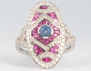 An 18ct white gold platinum, diamond, ruby and sapphire ring, size P 