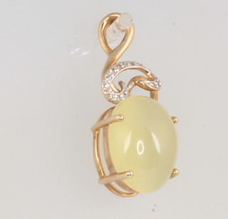 A 9ct yellow gold hardstone and diamond pendant