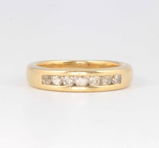An 18ct yellow gold channel set diamond ring 5.7 grams, size L 