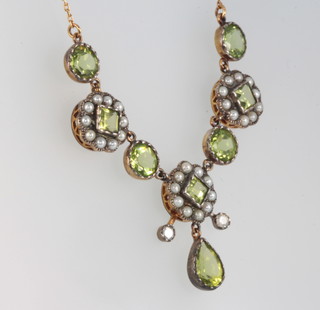 An Edwardian style silver gilt peridot and seed pearl necklace 