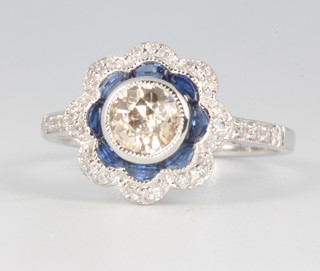 An 18ct white gold sapphire and diamond ring, the centre brilliant cut stone approx. 0.9ct, size N 