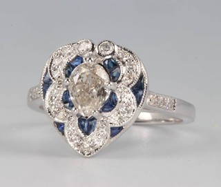 An 18ct white gold Victorian style heart shaped diamond and sapphire ring, the centre pear cut diamond approx. 0.65ct, size N 