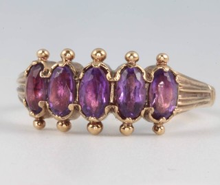 A 9ct yellow gold 5 stone amethyst ring size N 
