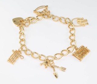 A 9ct yellow gold charm bracelet with padlock 20.5 grams