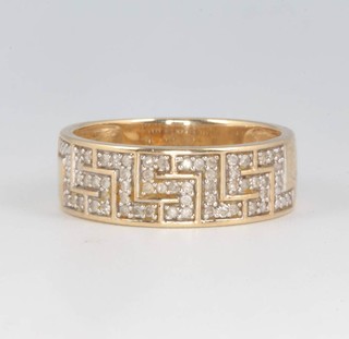 A 9ct yellow gold Greek key pattern diamond set ring size O 1/2, 3.5 grams