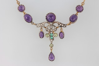 A silver gilt Edwardian style amethyst, peridot, emerald and diamond necklace