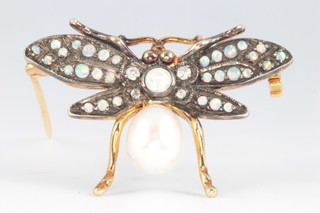 An Edwardian style silver gilt pearl, opal and diamond moth brooch