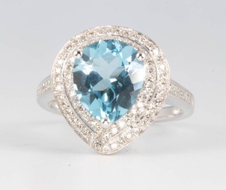 A 14ct white gold pear cut topaz and diamond ring, the centre stone approx. 4.42ct, the brilliant cut diamonds approx. 0.6ct size N 