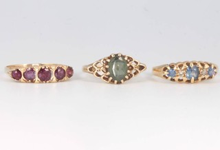 Three 9ct yellow gold gem set rings size N, 0 1/2 and P 