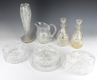 A cut glass fruit bowl 20cm and 2 others 19cm, a circular tray 25cm, pair of decanters and vase and a jug 