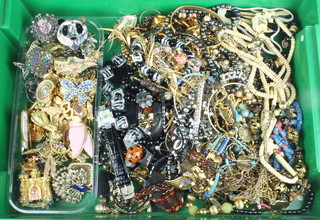 A quantity of costume jewellery including designer brooches 