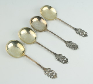 Four Continental 830 standard spoons with fancy floral handles 140 grams 