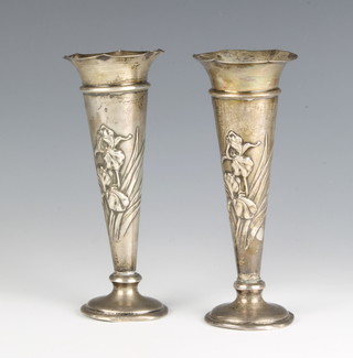 A pair of Art Nouveau silver repousse tapered spill/posy vases decorated with Irises London 1904, maker William Comyns & Sons Ltd 17cm 