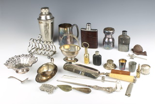 A silver plated cocktail shaker, a 7 bar toast rack and minor plated items 