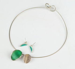 A silver and enamel necklace and matching earrings