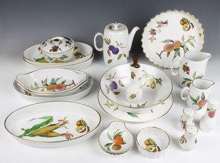 A quantity of Royal Worcester Evesham pattern tableware comprising coffee pot, milk jug, cream jug, 4 oval vegetable dishes, 1 cake stand, a bowl, 2 condiments, an oil bottle, 2 shell shaped dishes, fruit bowl, 2 oval dishes, a bowl and cover, flan dish, a casserole lid and a pepper 