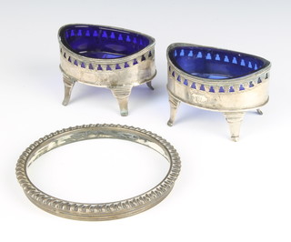 A pair of Georgian silver oval table salts with pierced decoration on splayed feet 8cm, together with a silver mount 