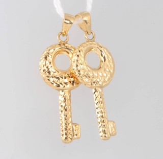 Two 9ct yellow gold bright cut key charms, 1 gram