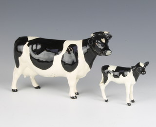 A Beswick Friesian cow CH.Claybury Leegwater no.1362A black and white gloss, 11.9cm together with a Friesian calf black and white gloss 8cm 