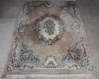 A sand grown and floral patterned Chinese carpet 372cm x 276cm 
