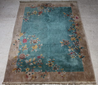 A 1930's green ground and floral patterned Chinese carpet 361cm x 270cm 
