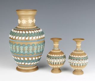 A Doulton Lambeth silicon oviform vase with geometric decoration 20cm, a pair of smaller ditto 11cm 