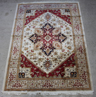 A brown ground and floral patterned Heriz style Belgian cotton carpet with central medallion 280cm x 200cm 