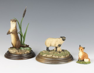 A Country Artists Group Suffolk Ewe and lamb CA37 9cm, a ditto fox cub 6cm and an otter standing CA498 19cm 