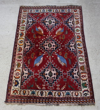 A red and blue ground Persian Qashqai rug with central medallion decorated 4 birds within floral and multi row borders 251cm x 158cm 