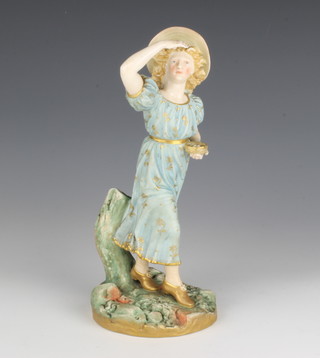 A Royal Worcester figure of a lady holding a birds nest filled with eggs 1293 23cm 