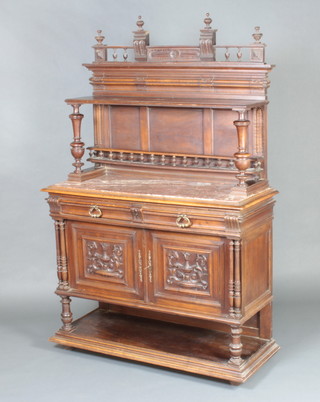 A 19th Century French carved walnut chiffonier the raised back with bobbin turned decoration and pink veined marble top, the base fitted 2 drawers above a double cupboard with undertier 187cm h x 120cm w x 46cm d 