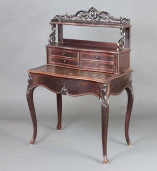 A 19th Century French rosewood writing table of serpentine outline, the upper section with pierced 3/4 gallery above a recess fitted 4 long drawers with inset leather writing surface, the base fitted 1 long drawer raised on cabriole supports 124cm h x 80cm w x 50cm d  