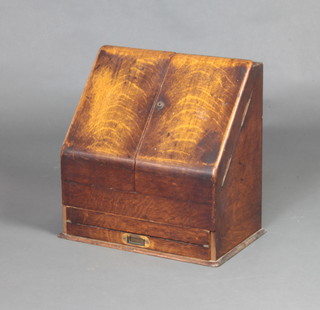 Parkins and Gotto, 24-26 Oxford Street London, a Victorian light oak wedge shaped stationery box with well fitted and stepped interior, the base fitted a writing slope (interior writing slope missing) 43cm h x 43cm w x 29cm d 