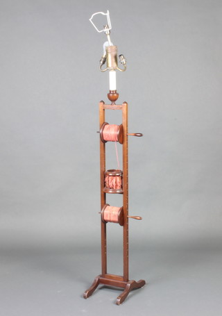 An Edwardian mahogany squirrel cage wool winder, converted for use as an electric standard lamp 138cm h x 16cm w x 33cm d 
