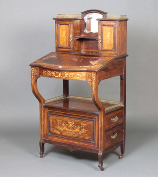 A Victorian inlaid rosewood bonheur du jour/whatnot Canterbury, the raised superstructure to the back with brass gallery fitted a mirror and recess flanked by a pair of cupboards, the fall front revealing a fitted interior above a recess, the base fitted 2 long drawers with swan neck drop handles (1 handle missing) 117cm h x 61cm w x 47cm d 