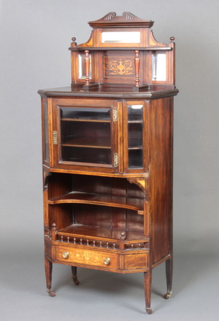 A rosewood display cabinet with raised back, the base fitted shelves enclosed by a bevelled plate panelled door above a recess and 1 drawer 140cm h x 60cm w x 42cm d 
