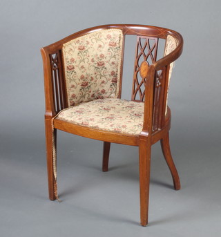 An Edwardian inlaid mahogany tub back chair with upholstered seat and back, raised on square tapered supports 
