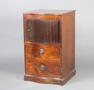 A Georgian mahogany commode of serpentine outline fitted a cupboard enclosed by a tambour shutter above a cupboard raised on a platform base 81cm h x 50cm w x 47cm d 