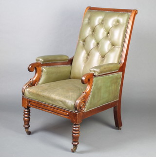 A Regency mahogany show frame library chair, the seat and back upholstered in green leather 