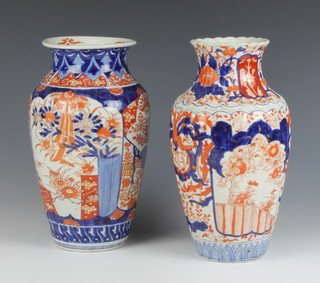 An early 20th Century fluted Imari oviform vase decorated with panels of flowers 31cm, a ditto 31cm 