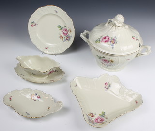 A Czechoslovakian dinner service with moulded floral decoration comprising tureen and cover, 12 dinner plates, 12 side plates, 12 soup bowls, 12 side plates, sauce boat, 4 dishes and 4 graduated plates 