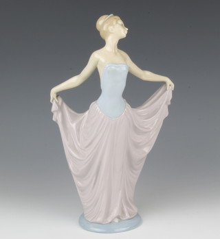A Lladro figure of a lady holding aloft her skirt 29cm 