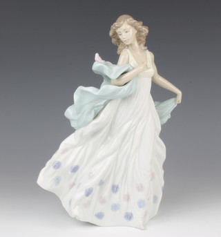 A Lladro figure of a lady with a bird on her shawl no.6193, 30cm 