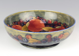 A William Moorcroft shallow bowl decorated with pomegranates with impressed and monogram marks 20cm 