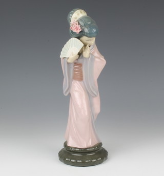 A Lladro figure of a Japanese lady holding a fan 28cm 