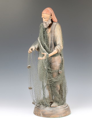 A Victorian pottery figure of a pipe smoking fisherman holding his net, indistinctly signed 55cm